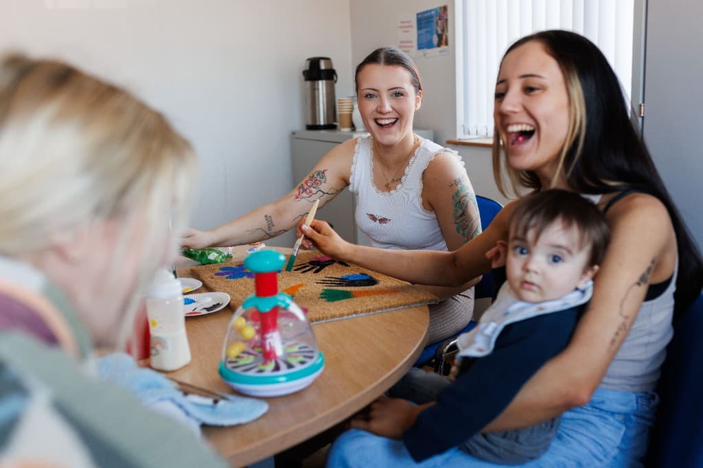 Women and children taking part in a craft group at Ballybeen Women's Centre